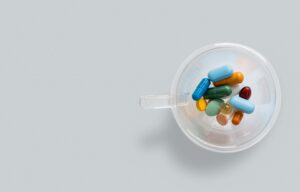 Clear Container Holding Multi Color Pills
